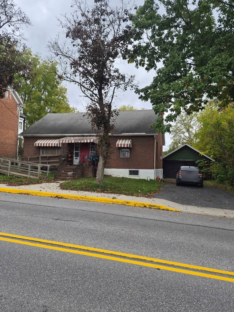 434 West Pitt Street with the paved driveway and detached two-car garage