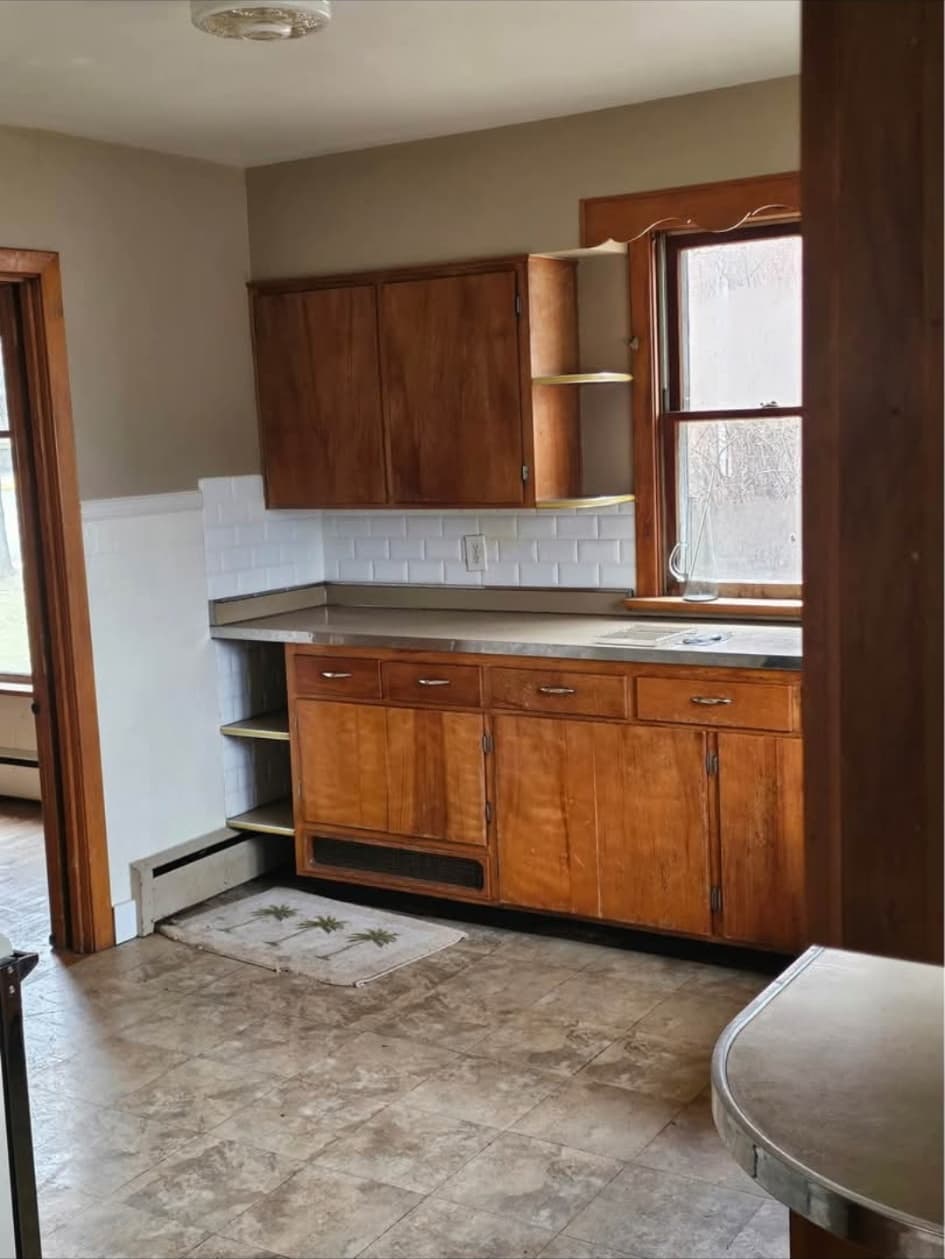 Front-house kitchen with wood cabinets and subway tile